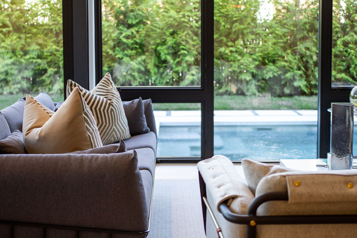Hamptons custom home architecture pool against house