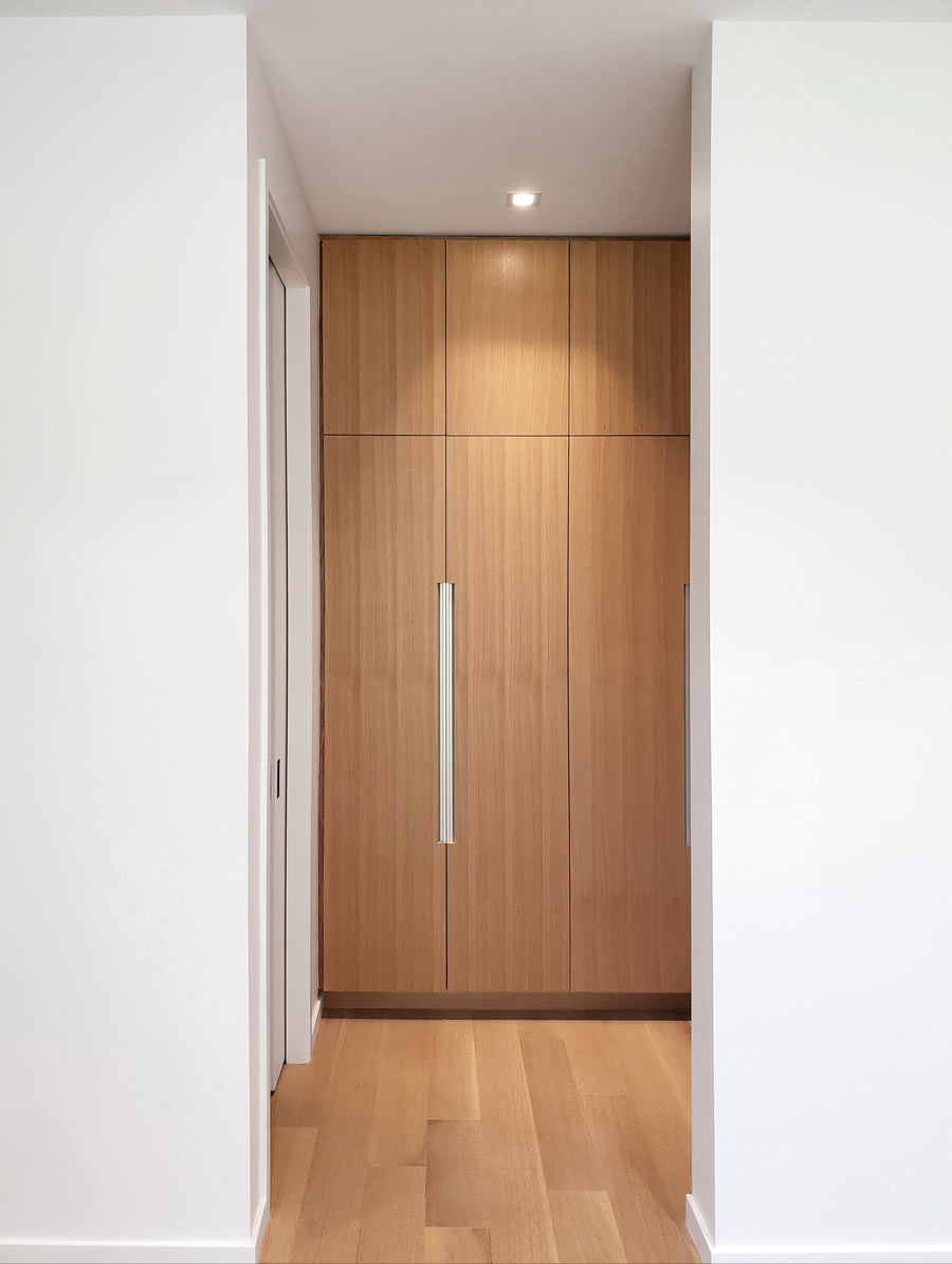 custom home design with matching panel closet doors and hardwood floors