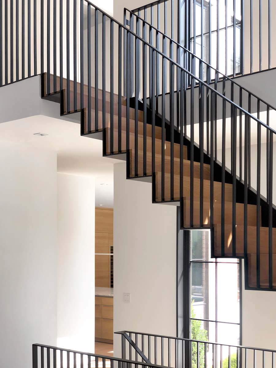 modern li home design with custom steel stair and open floor plan