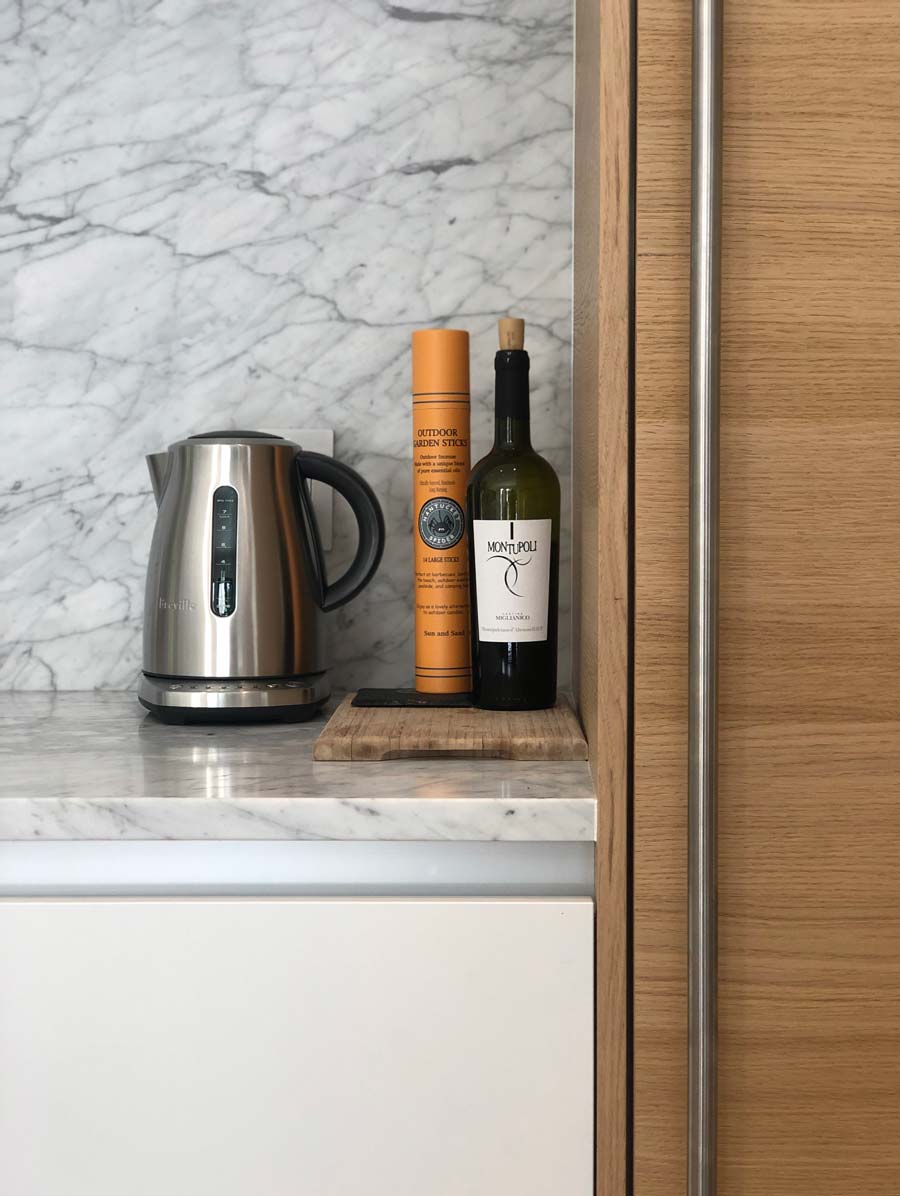 new york modern kitchen design architectural detail with wood panel-ready refrigerator