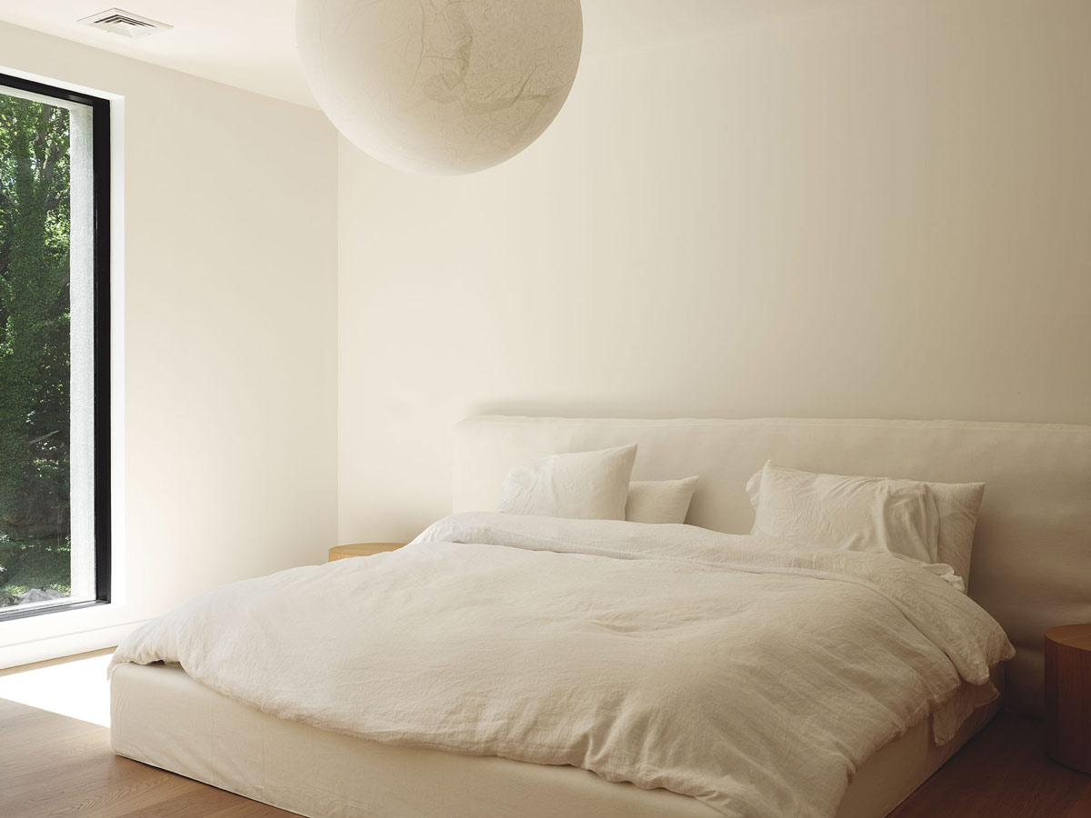 Hig-end globe pendant lighting fixtures in a modern home by The Up Studio.