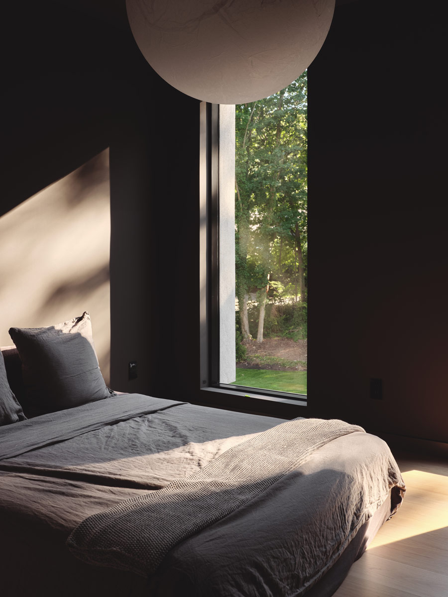 globe pendant with dark minimal bedroom interiors in modern home