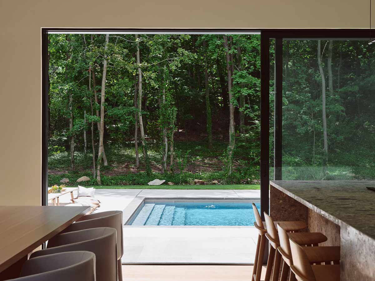 indoor outdoor modern home design in the woods