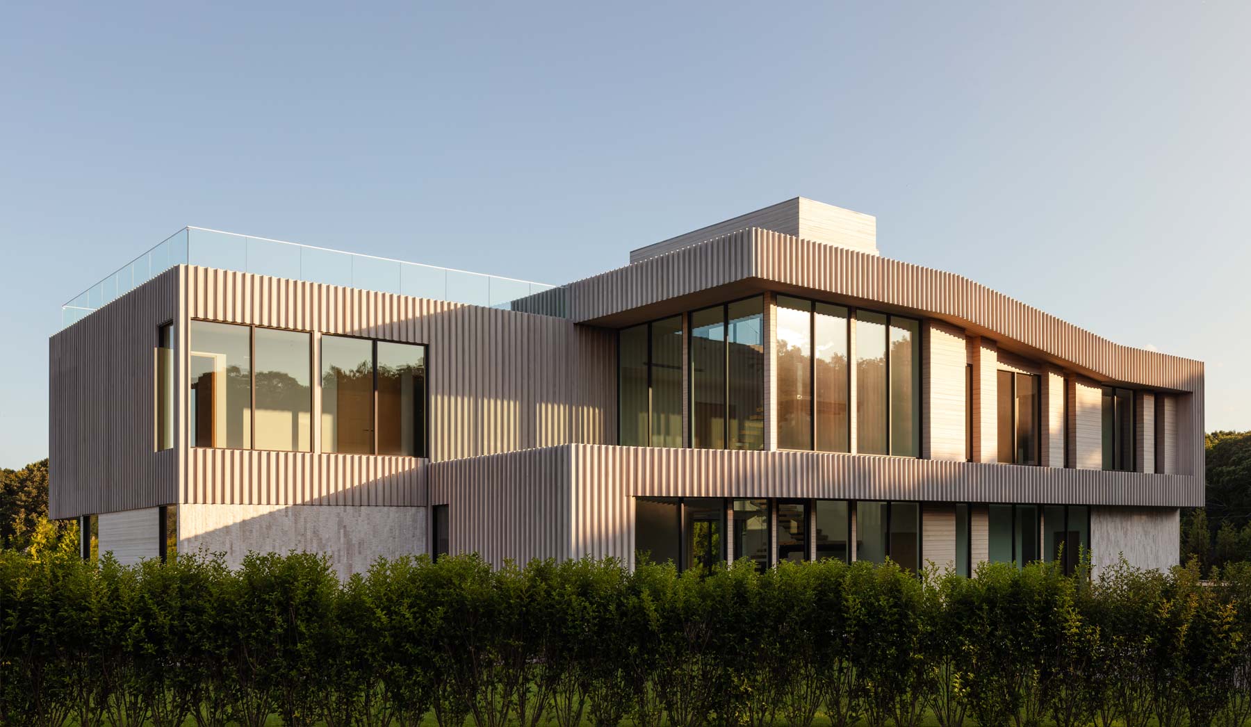tranquil modern light wood home architecture in the hamptons Water Mill neighborhood