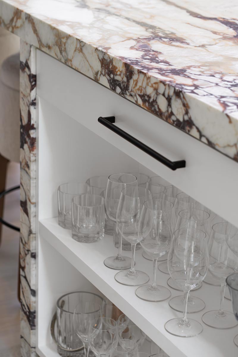 millwork detail in custom cabinetry calcatta wet bar
