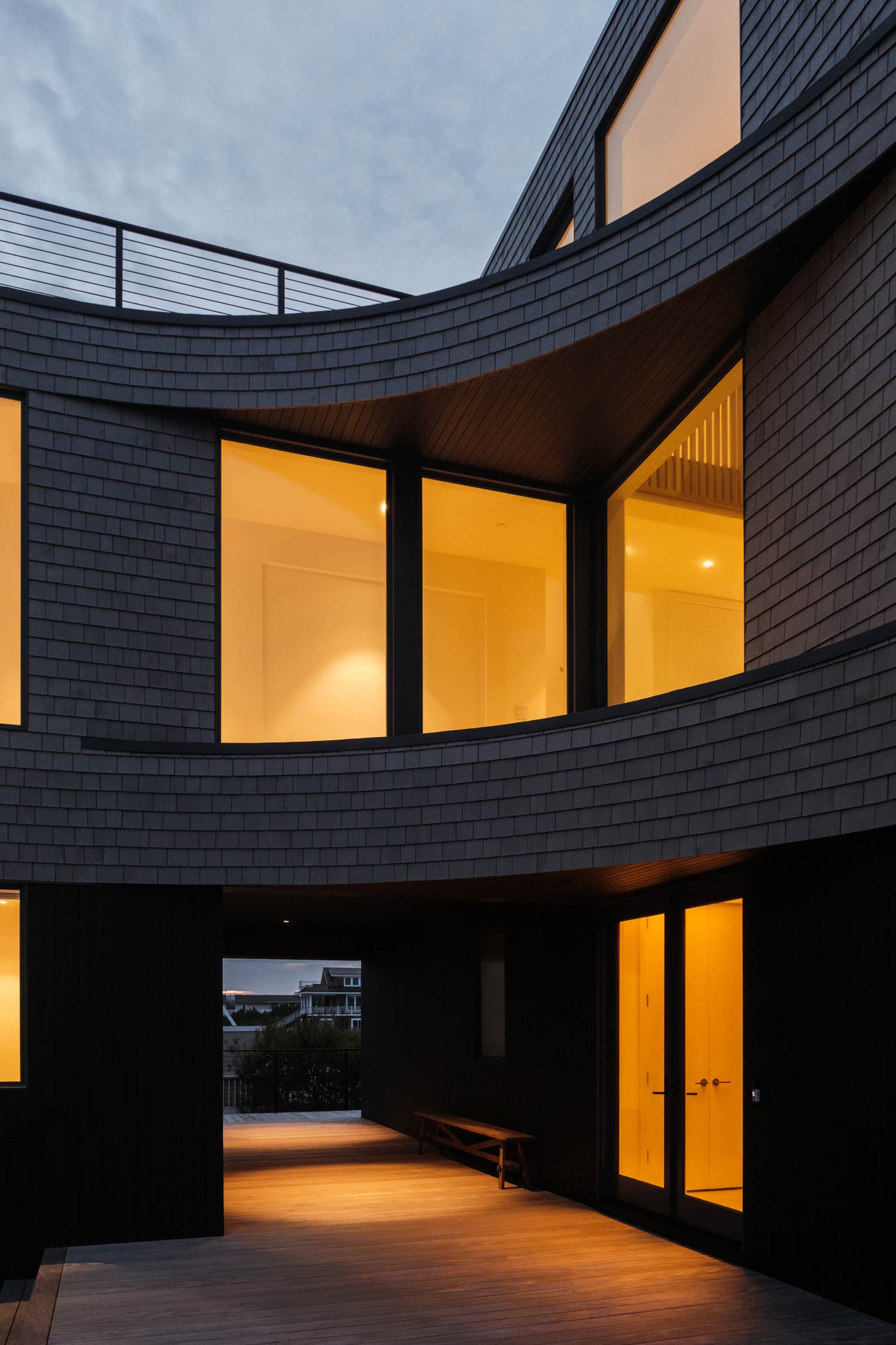 curved entryway to hamptons luxury modern beach house architecture