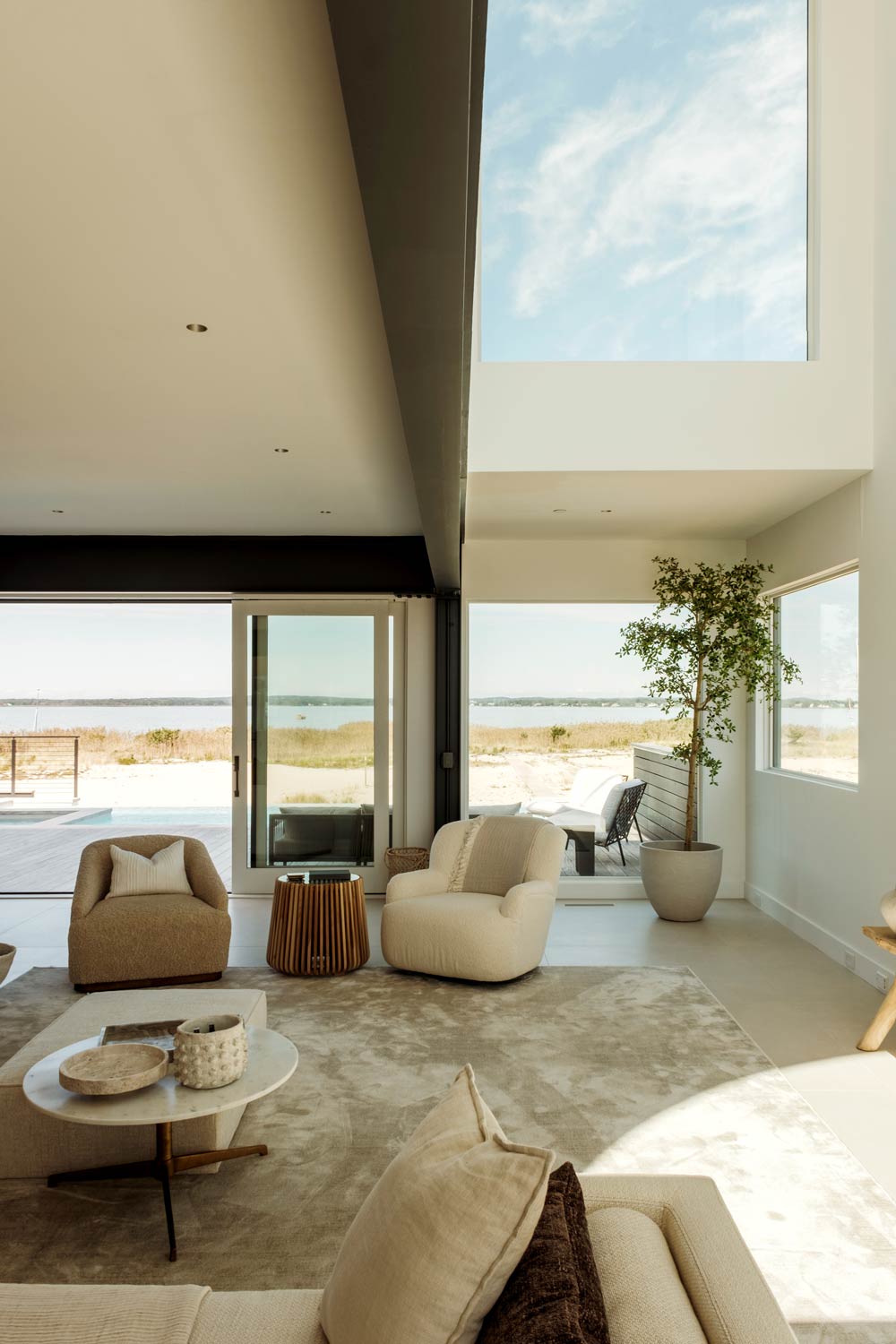 double height living room in modern beach house interior design