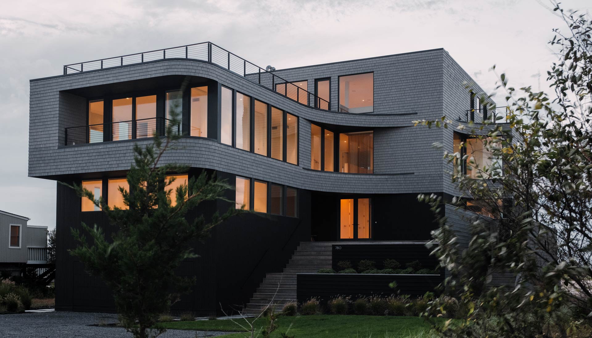 dusk at hamptons lifted dune road beach house architecture