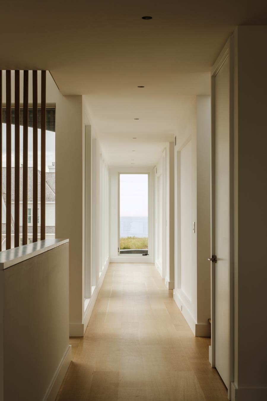 hamptons ocean views in hallway of modern beach house design