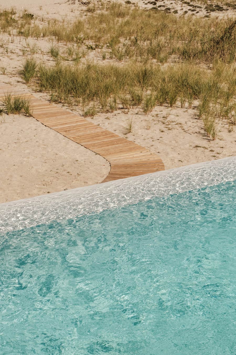 infinity edge pool and hamptons dunes with boardwalk to bay