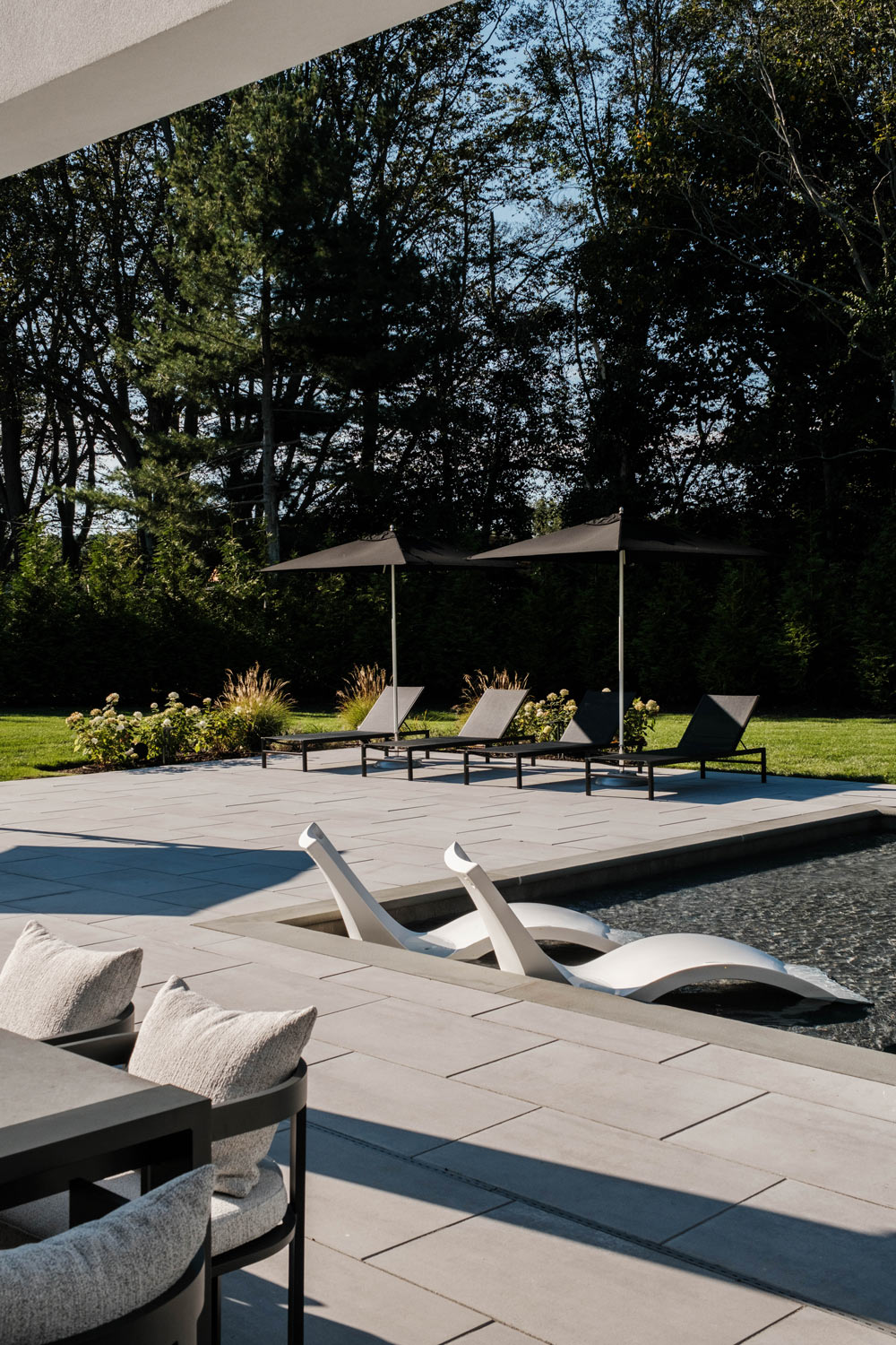 black modern pool and patio furnishings