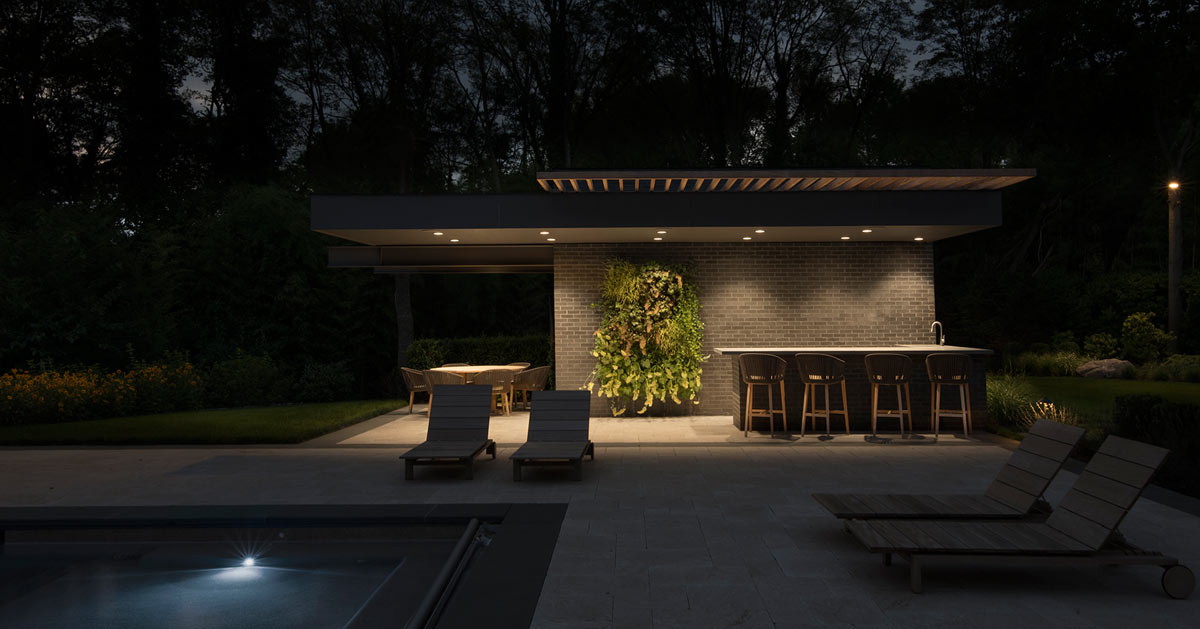 Black Brick Modern Pool House Cabana Lighting at Night