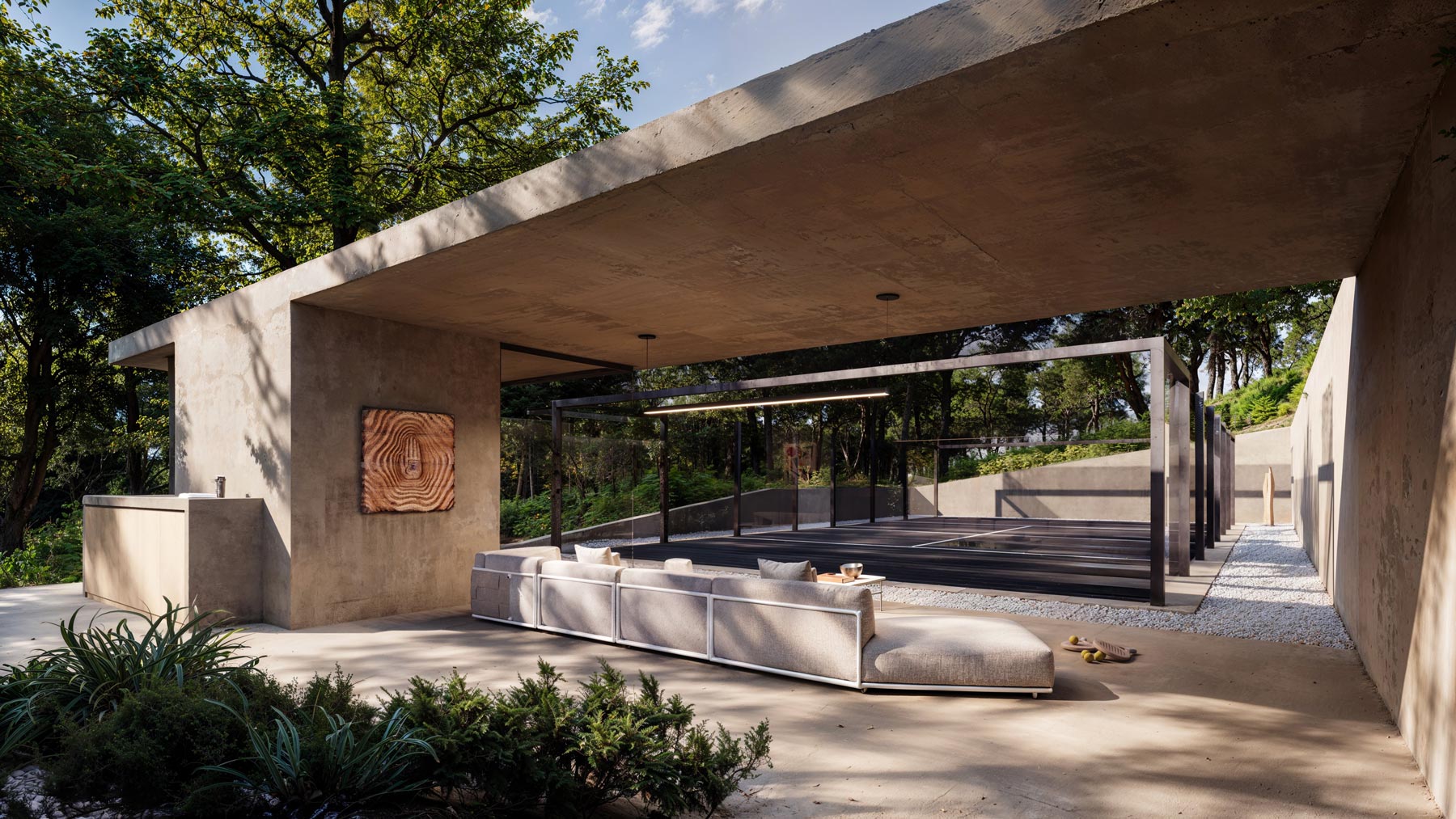 concrete modern outdoor racquet court architecture in the woods