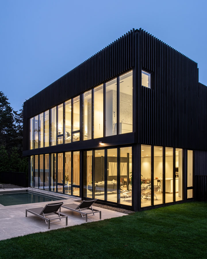 Custom black cedar home architecture at Dusk