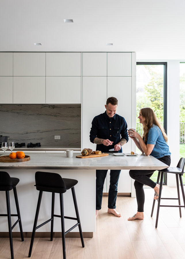 Trimless lightin in a modern home kitchen by The Up Studio.