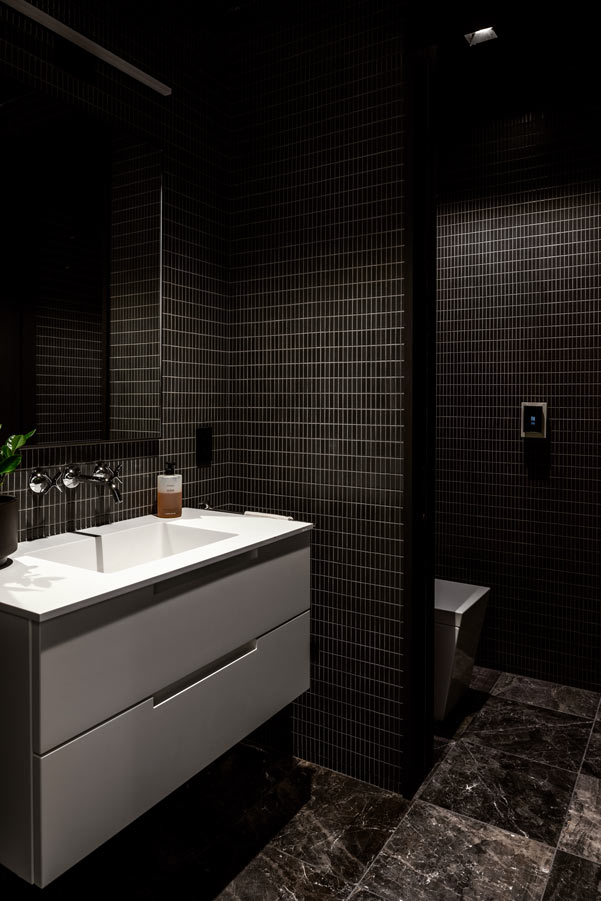 Kohler veil toilets in modern home by The Up Studio.