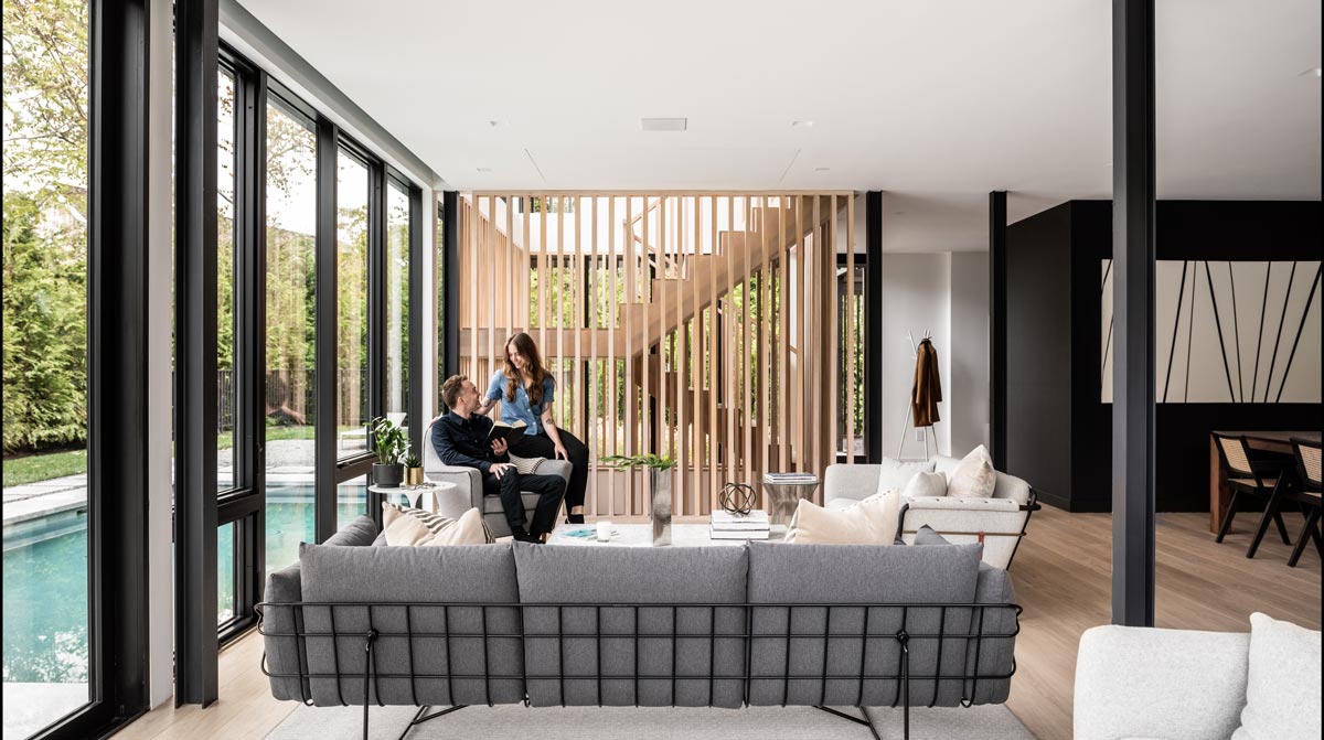 Hidden roller shade pockets on window wall in modern home by The Up Studio.