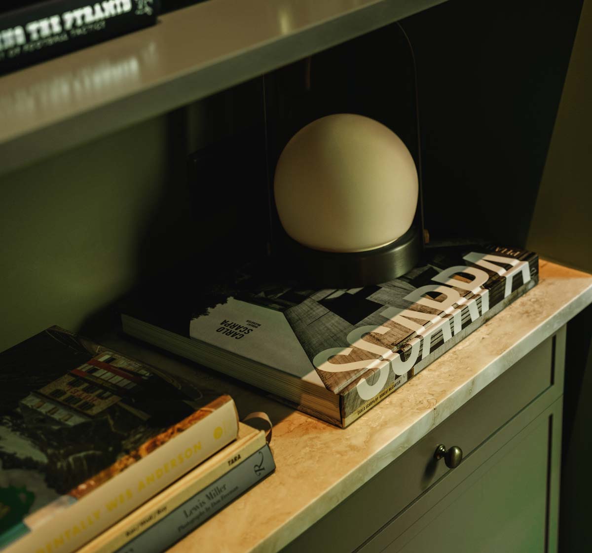 deep green custom millwork shelving in home office