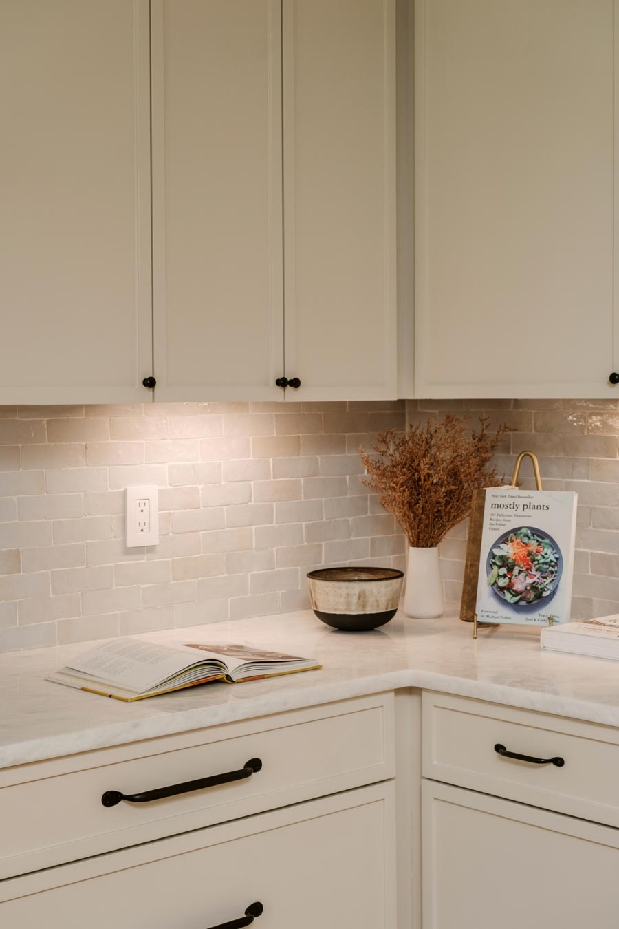 soft warm custom kitchen cabinetry with organic tile