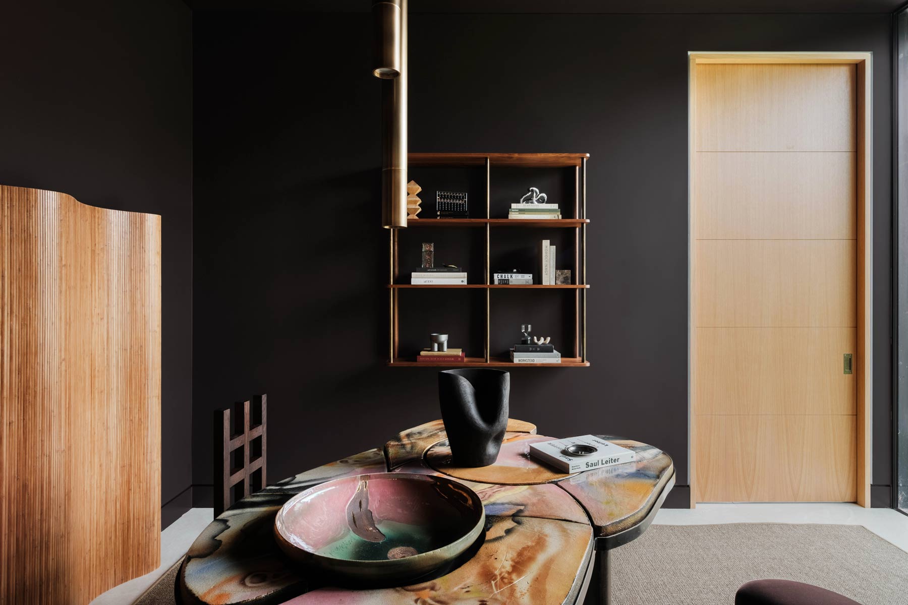 colorful ceramic office desk in dark moody office interior design