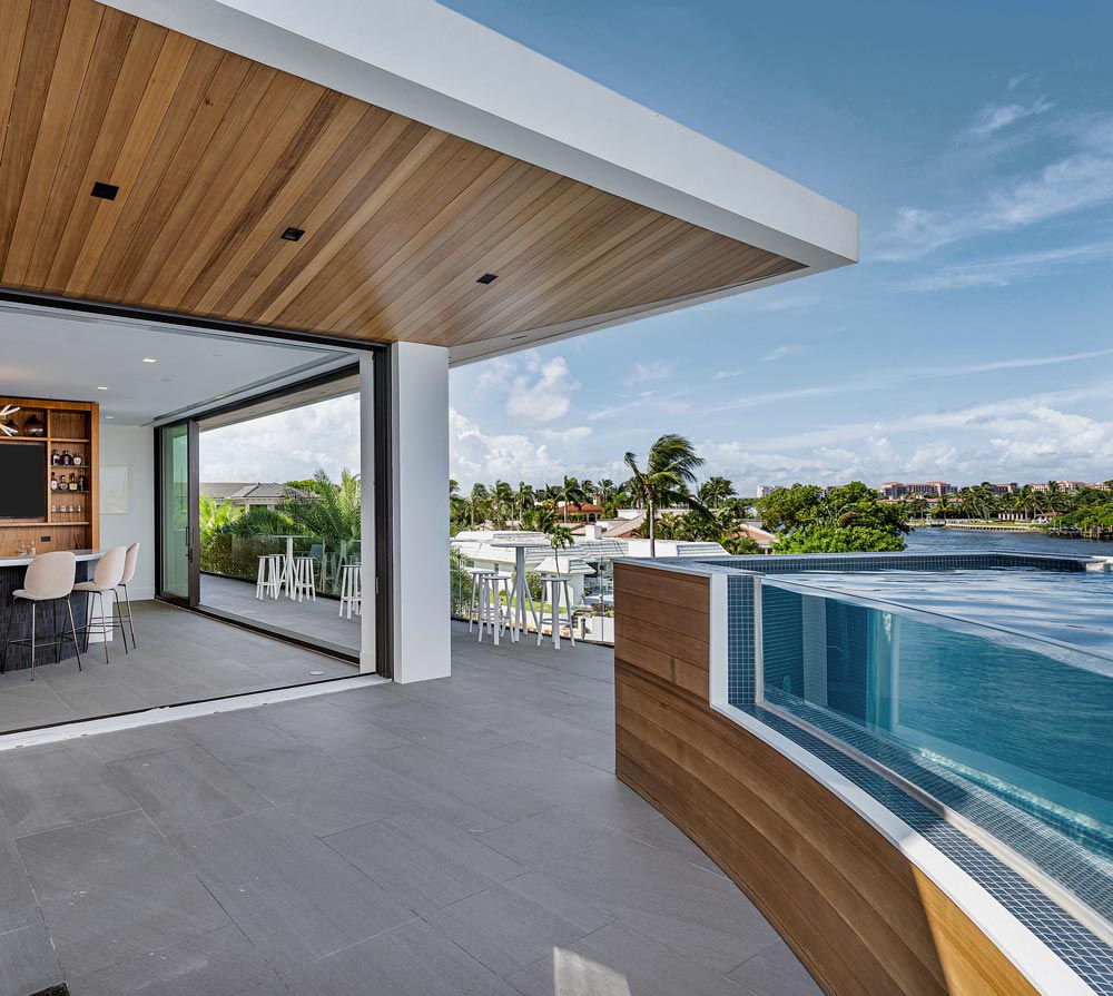 second story balcony plunge pool with aquarium glass wall