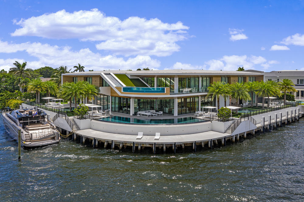 tropical modern waterfront home with dock and aquarium glass balcony pool medium