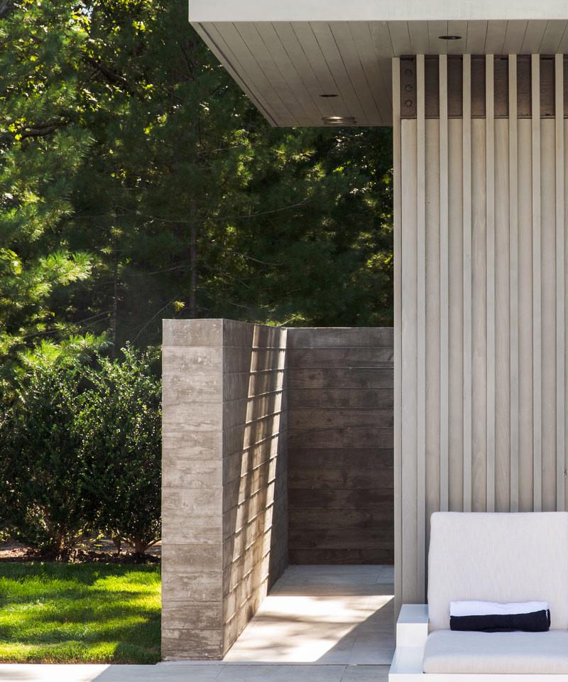 hamptons modern cabana with board formed concrete wall