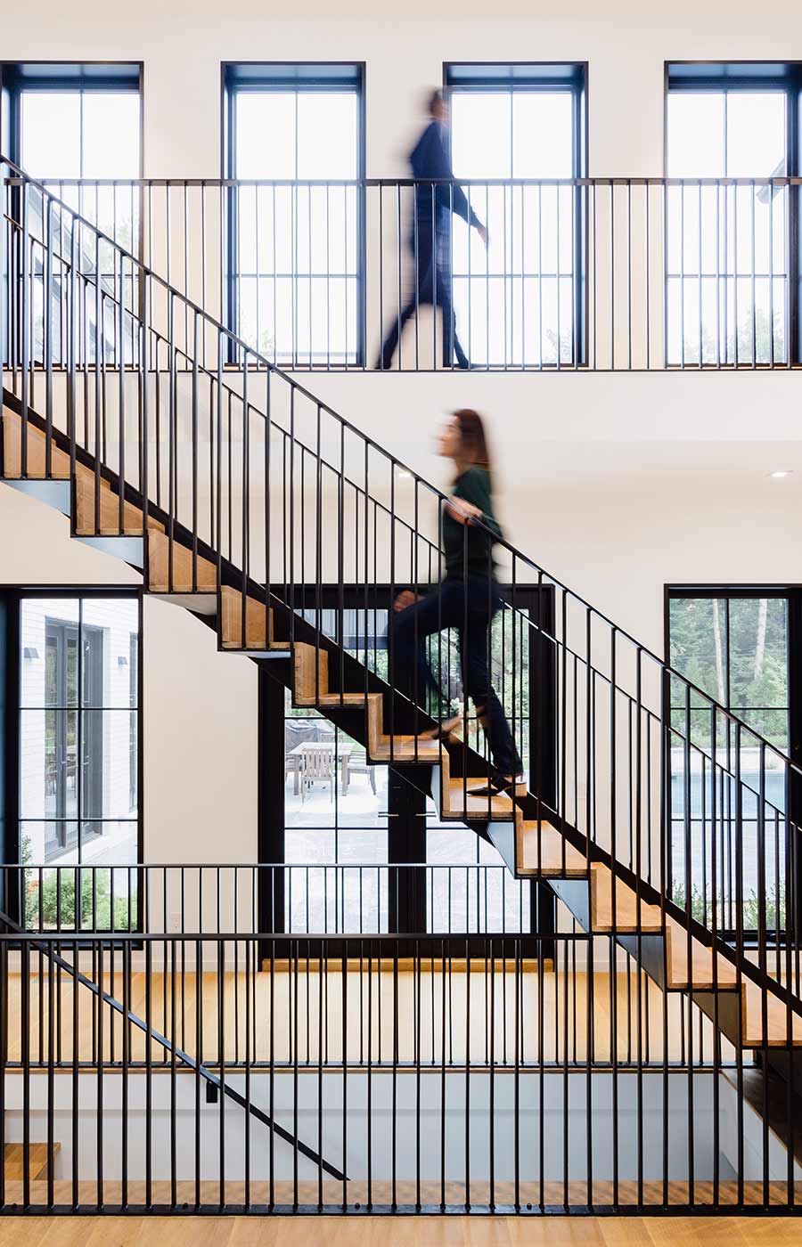 custom modern stair design blackened steel and natural wood on Long Island, NY home