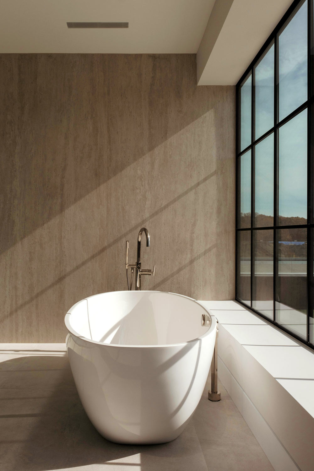 minimal floating tub in modern stone bathroom interiors