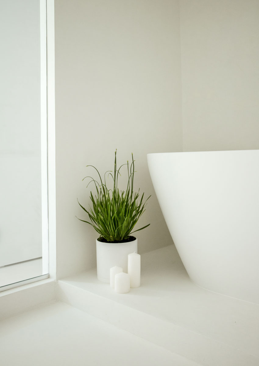 minimal bathroom interior with bath and microcement wetroom