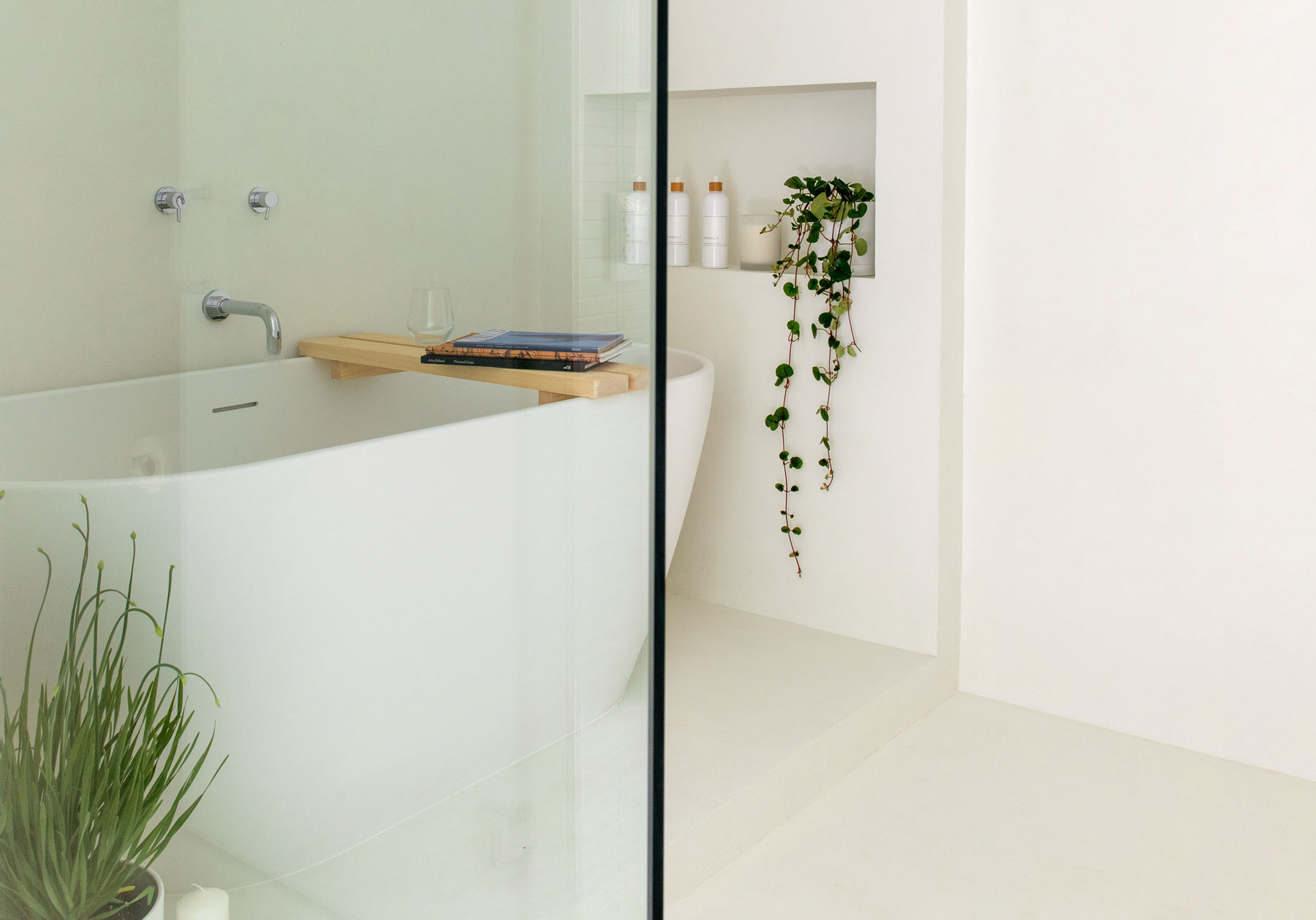 minimal modern bathroom interior with all-white microcement wetroom