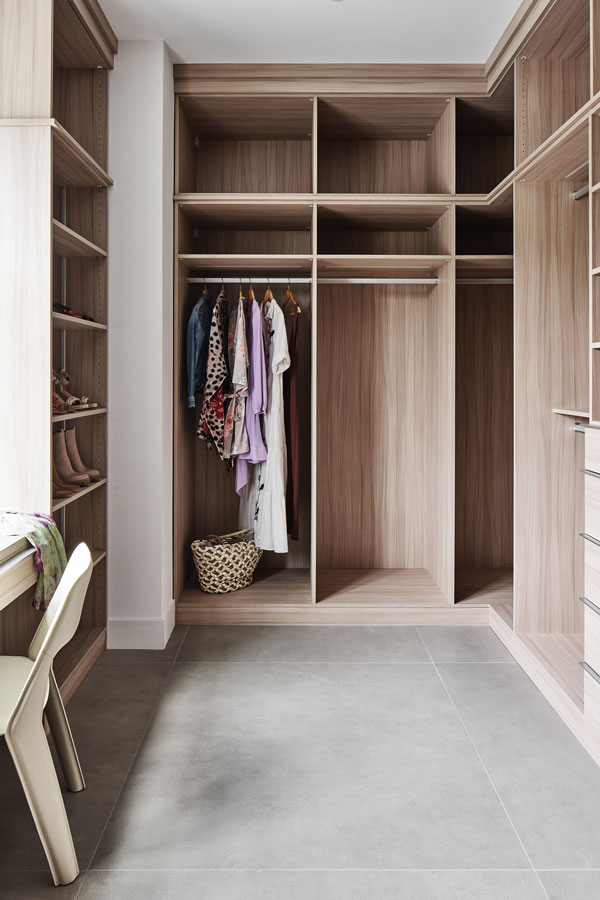 custom modern closet design with built in dressing bench millwork