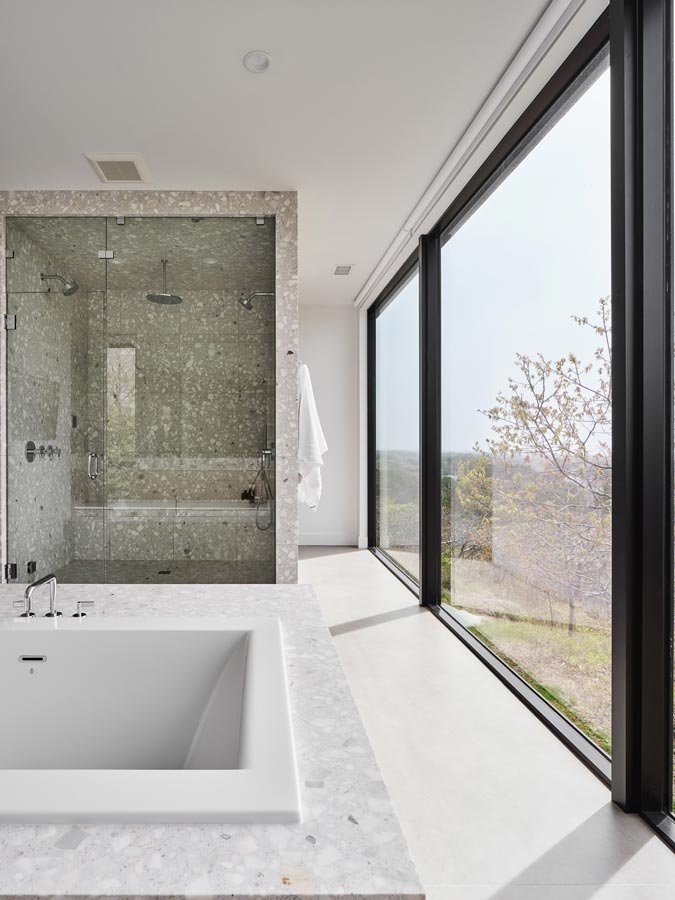 custom terrazzo shower and tub in modern bathroom interior