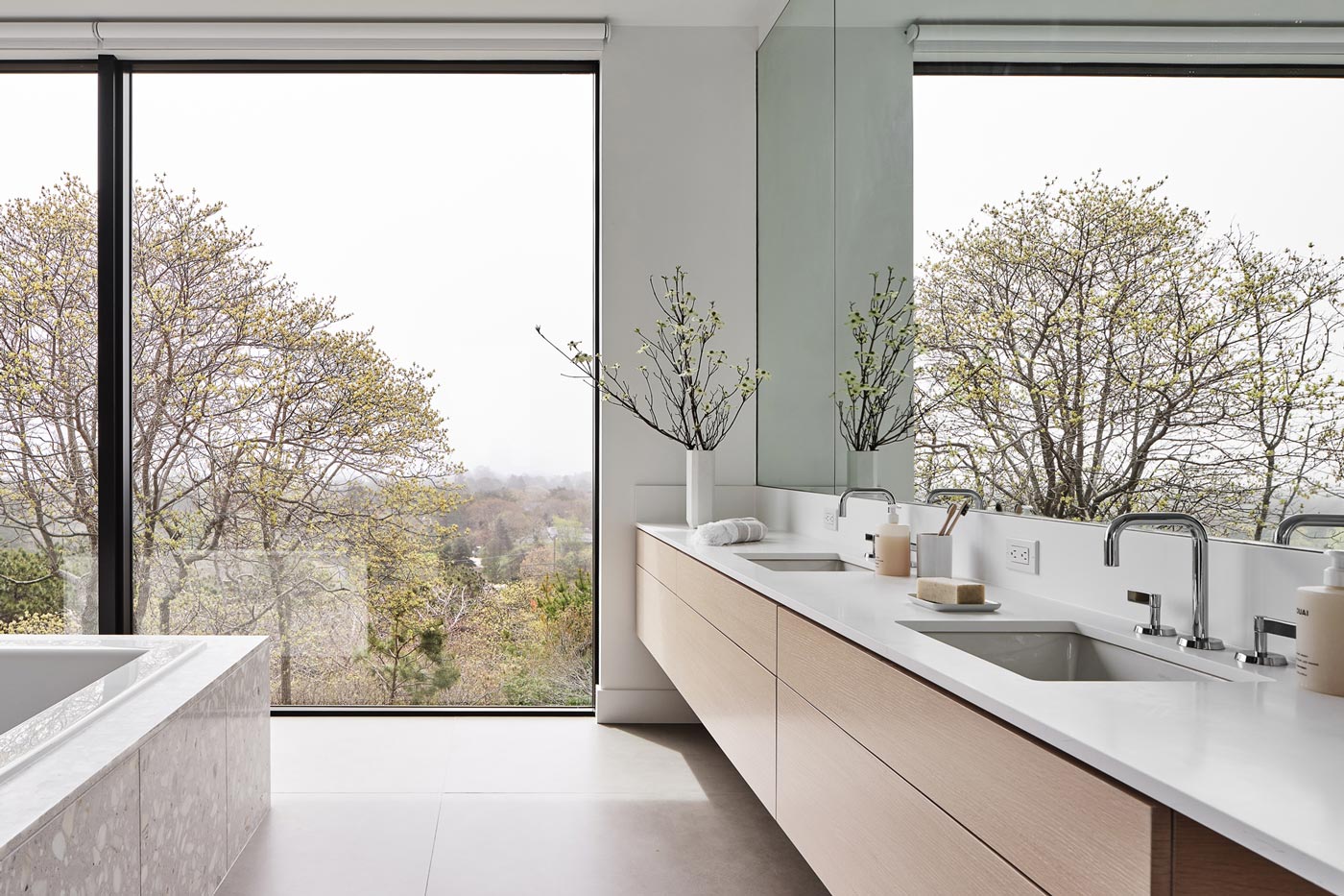 hamptons modern bathroom design with terrazzo tub and custom light wood vanity