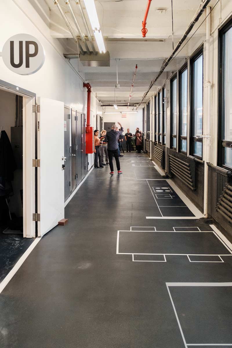 narrow nyc townhouse architecture full scale model taped out on the floor of a design studio