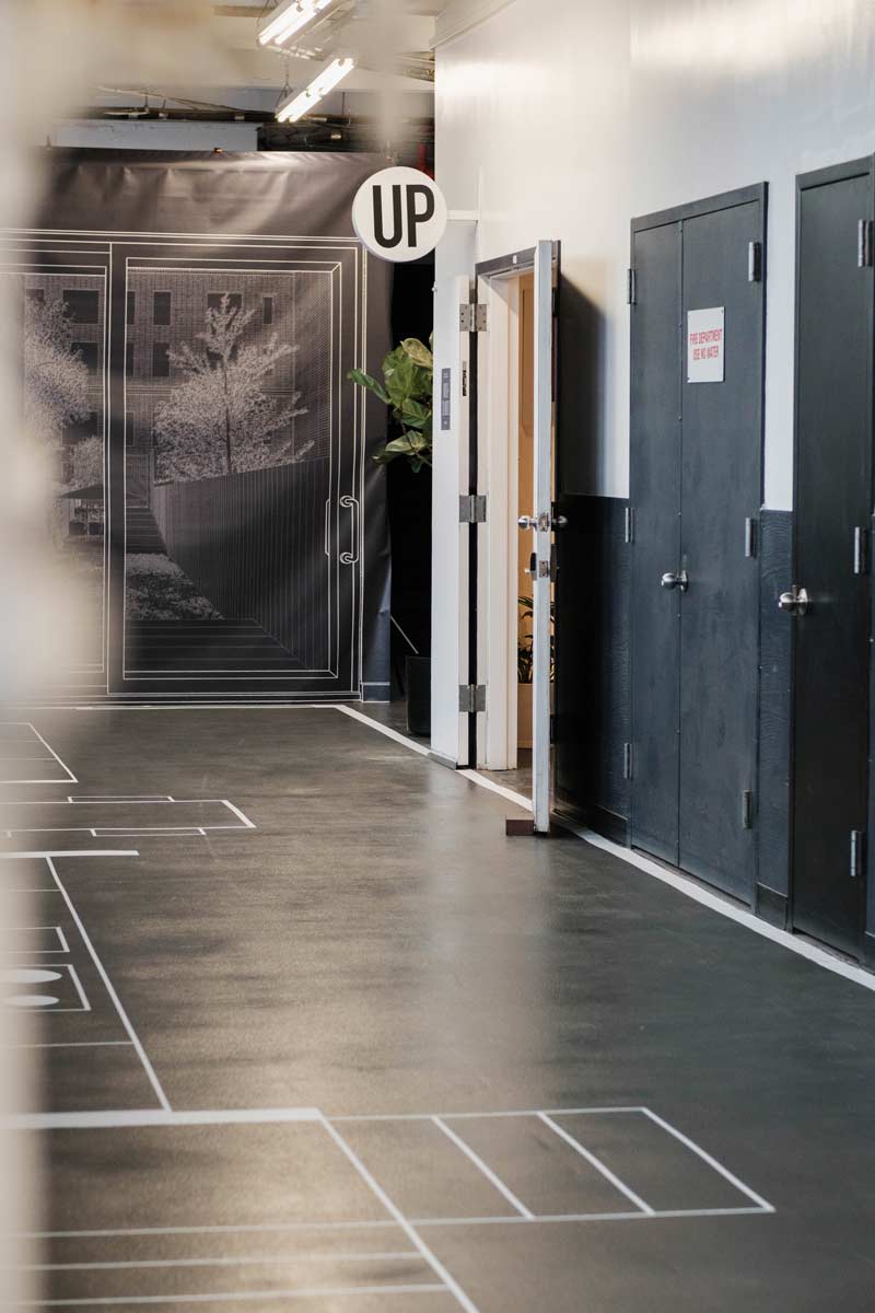 narrow nyc townhouse architecture full scale model taped out on the floor of a design studio