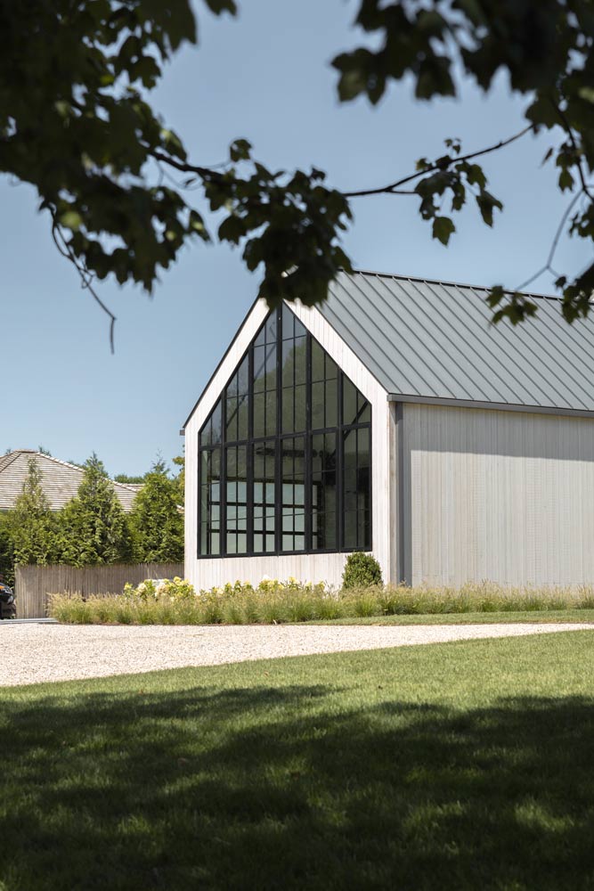 glass gable in modern farmhouse residence. architecture by the up studio