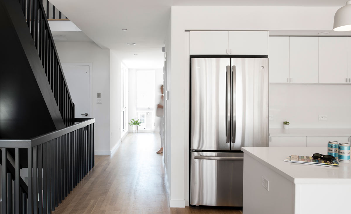 Long Island Modern Residential Architecture Black and White Kitchen and Stair Contrast